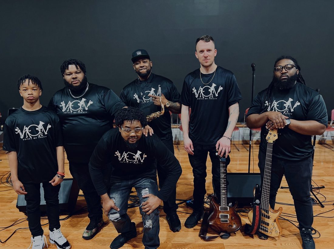 The V.O.V live band in matching shirts with their instruments