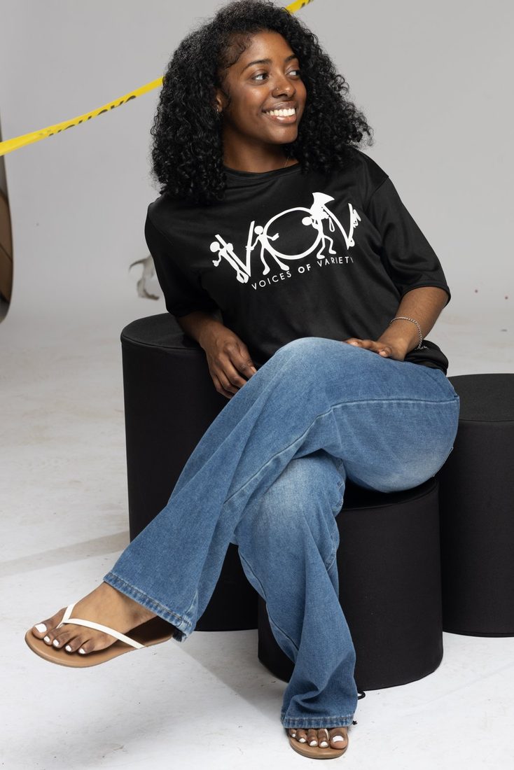 Model wearing the black V.O.V T-shirt with white logo