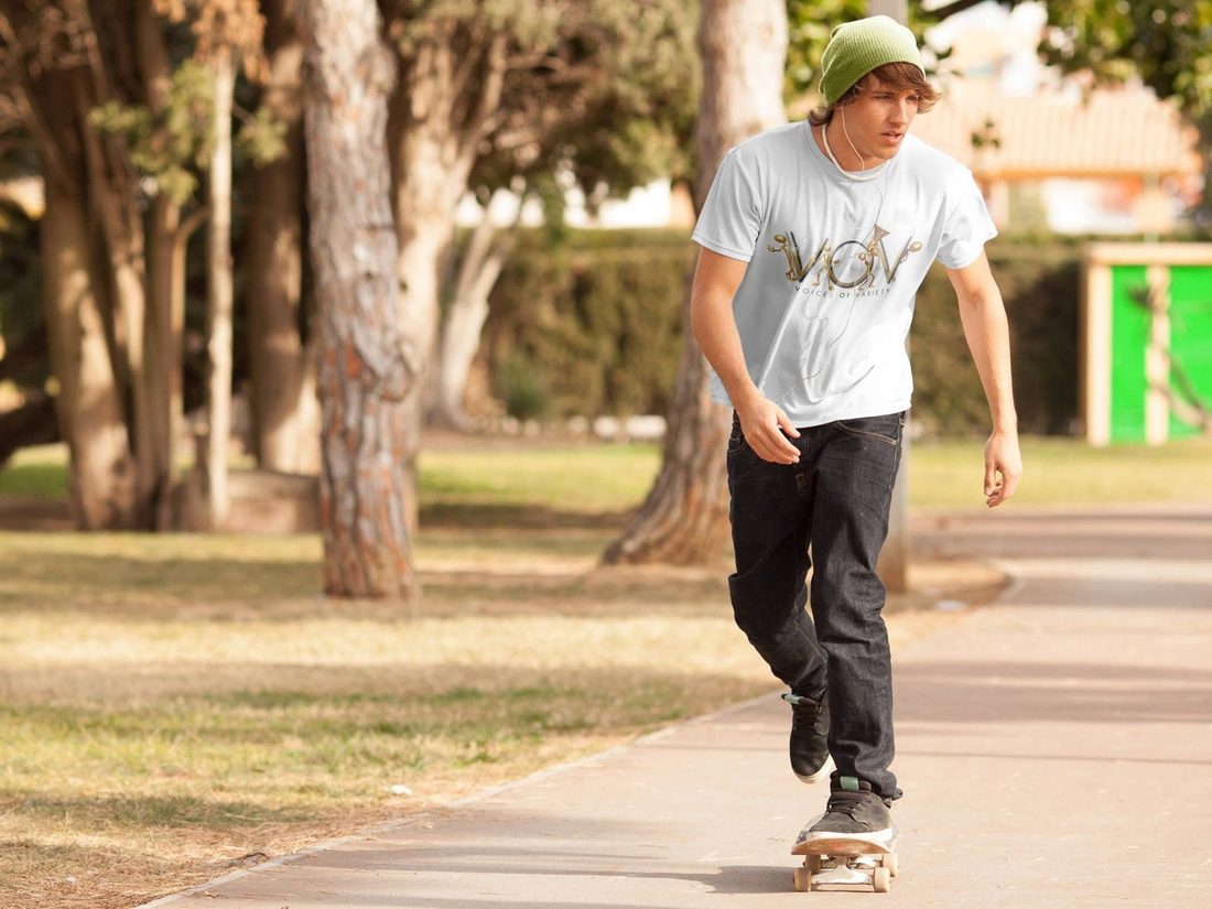 Skater cruising the park in a white V.O.V tee