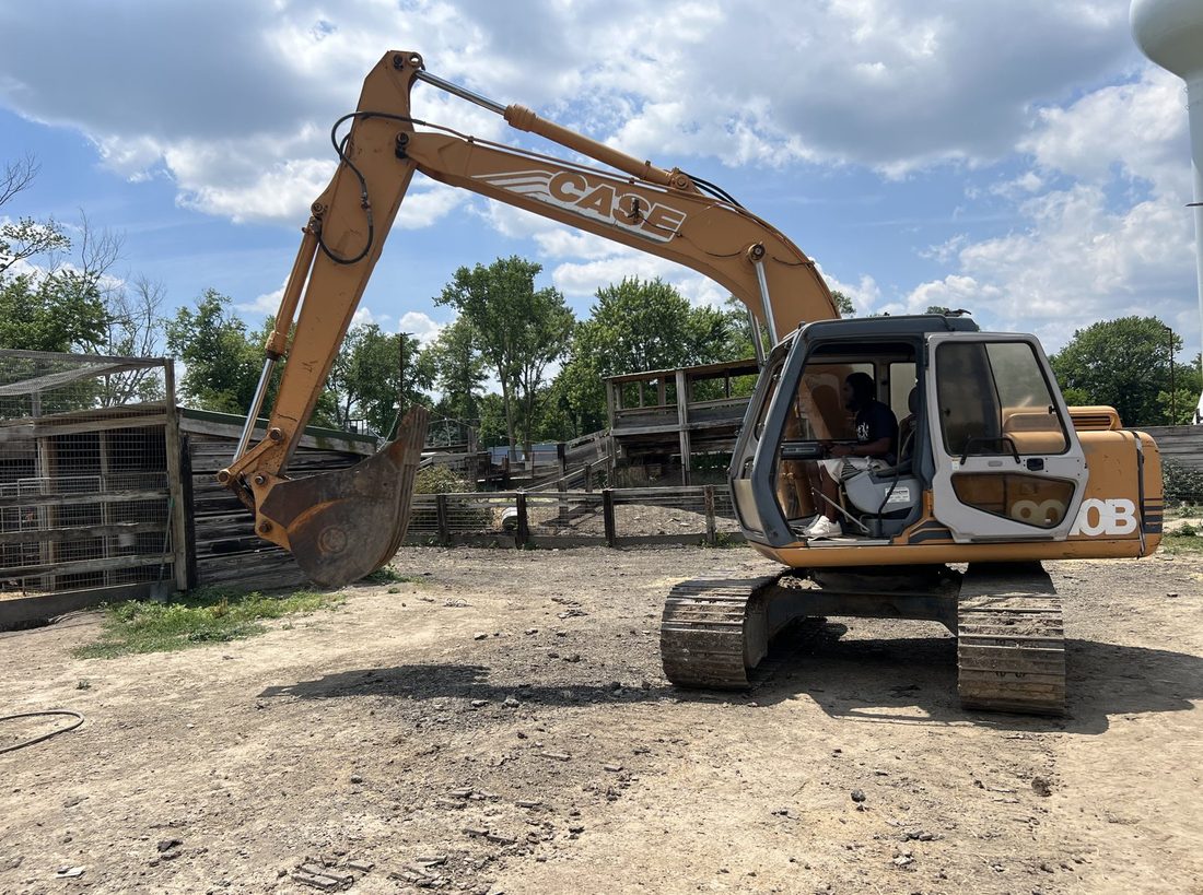 A V.O.V member operating an excavator