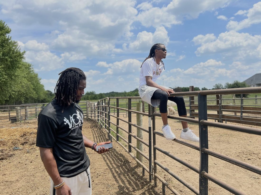 Two V.O.V members at the ranch fence on an exposure trip