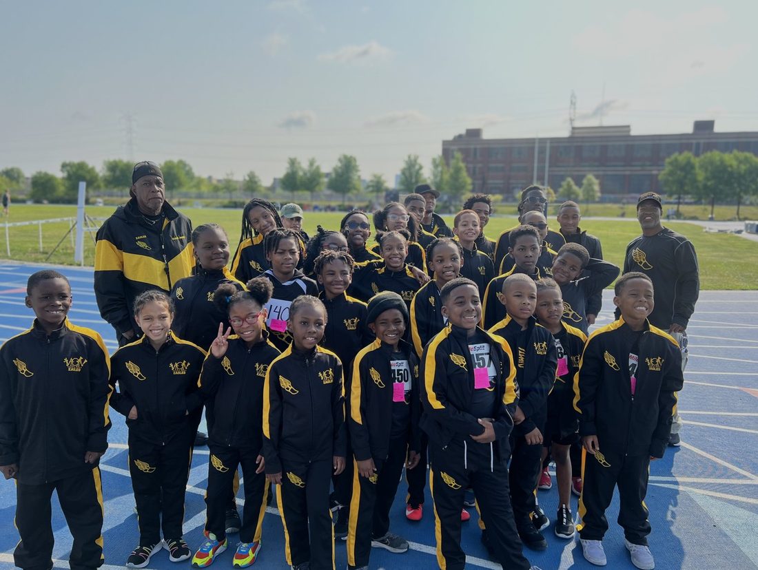 The V.O.V Eagles track team on the blue track