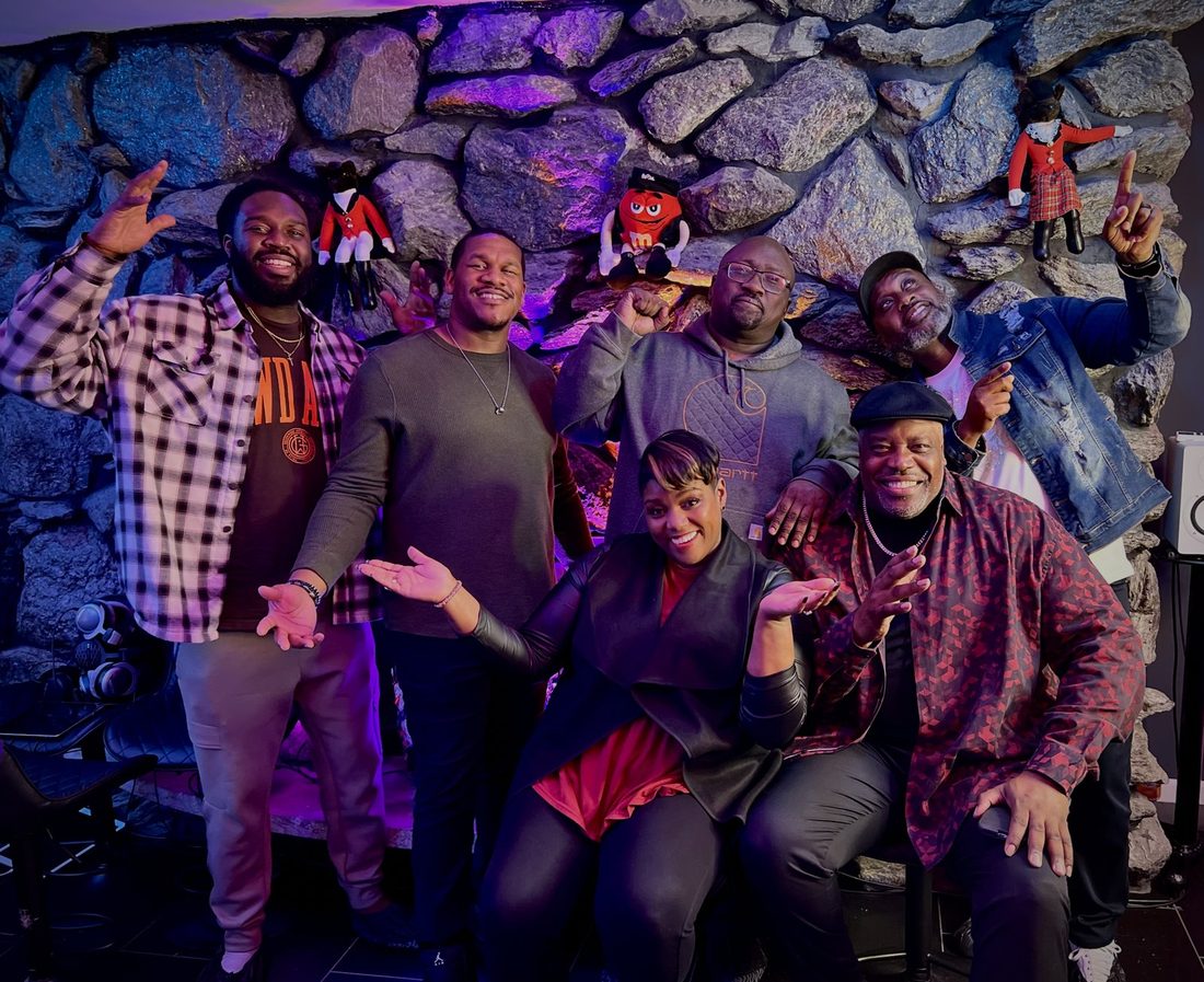 The V.O.V creative family posing in the studio