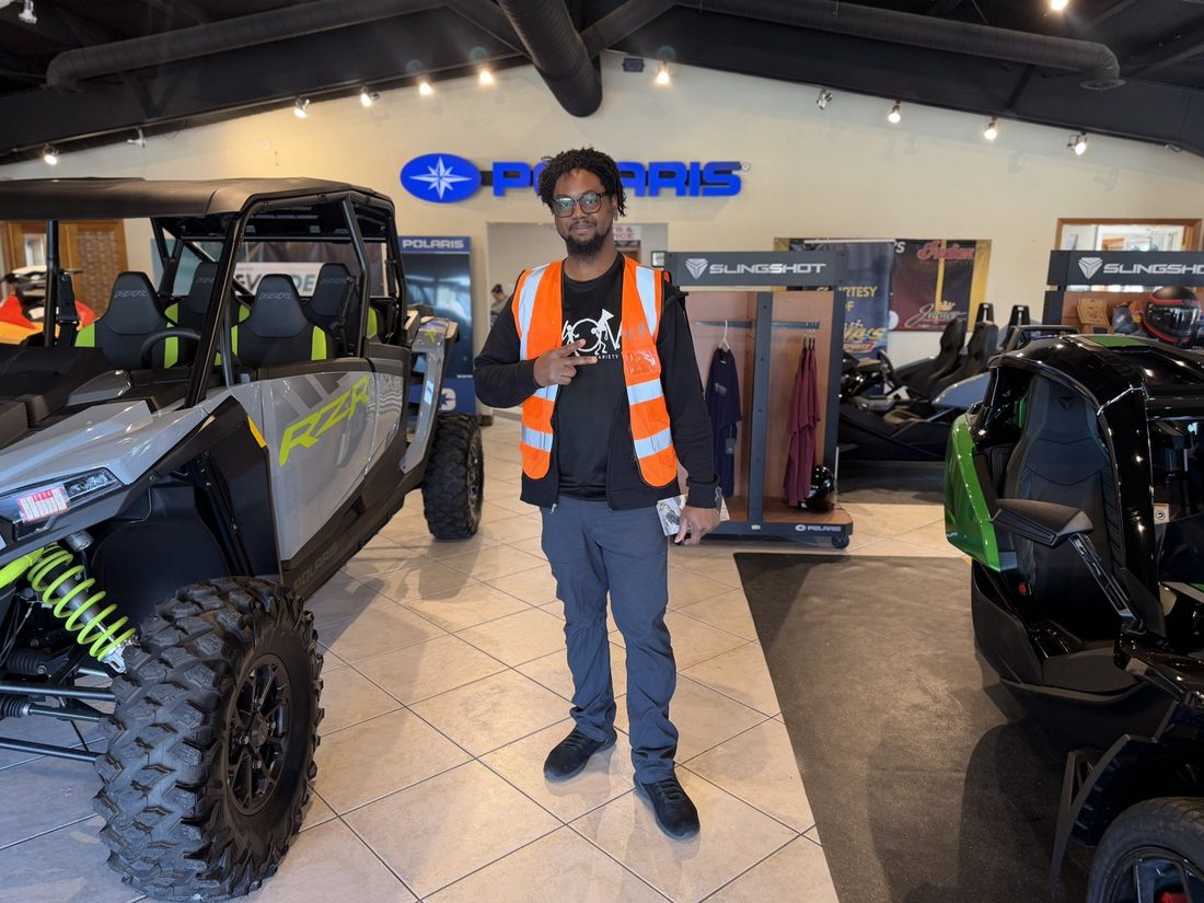 A V.O.V member scouting utility vehicles in the showroom