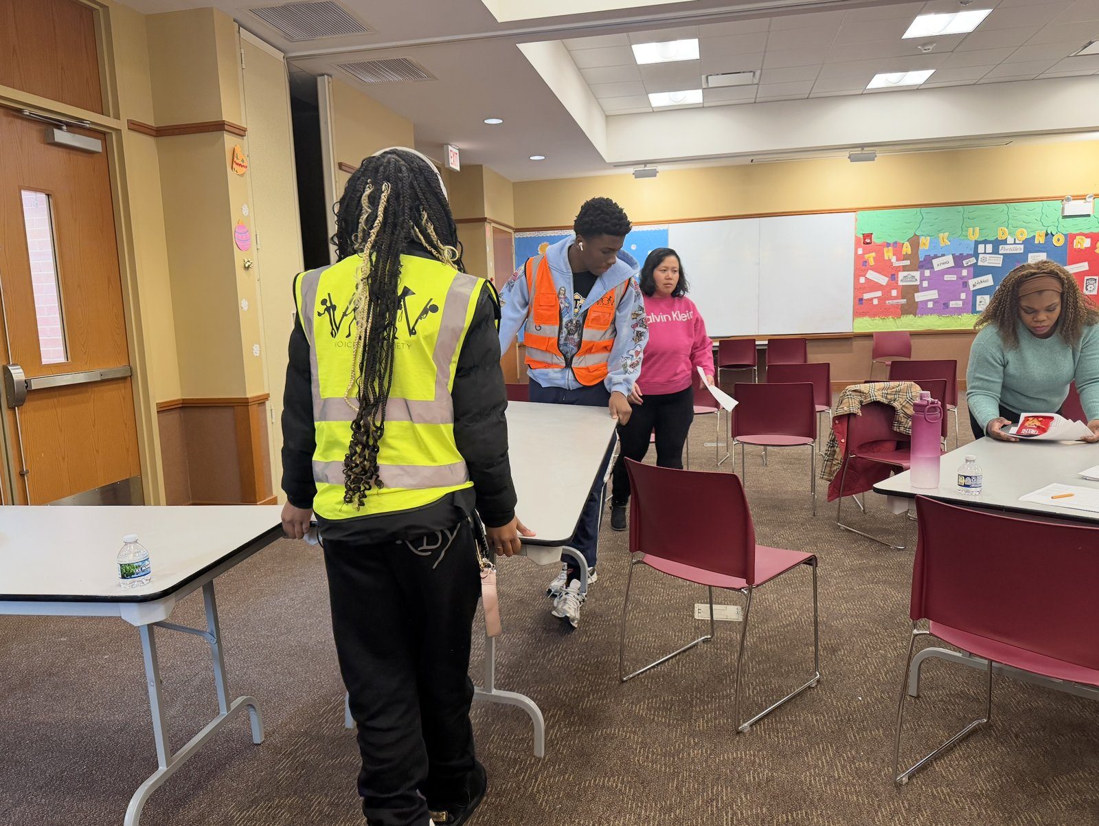 The V.O.V setup team arranging a community room