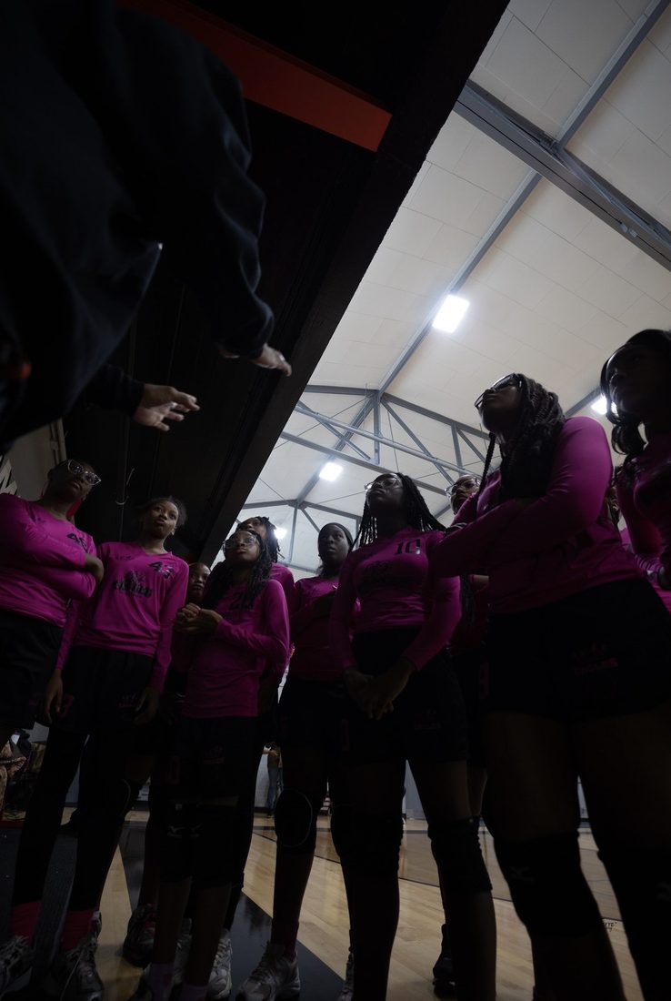 The V.O.V Eagles volleyball team huddled up listening to their coach