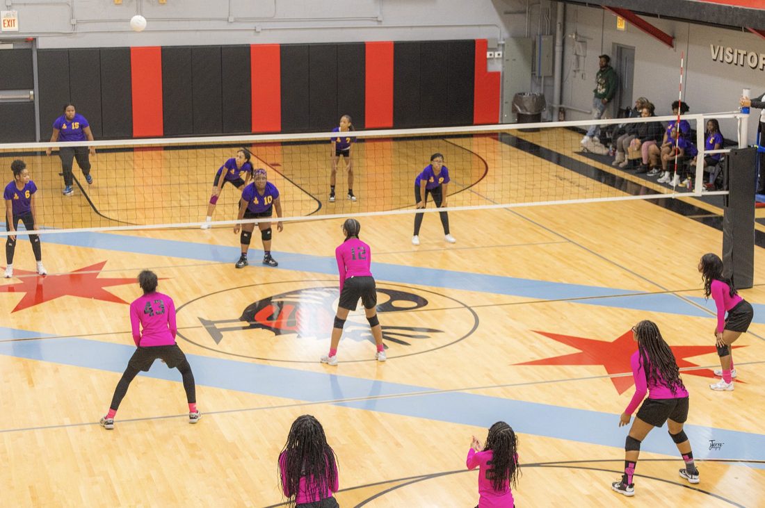 The V.O.V Eagles volleyball team playing a match on a full court